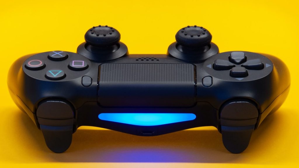 A ps controler with the blue light on the top