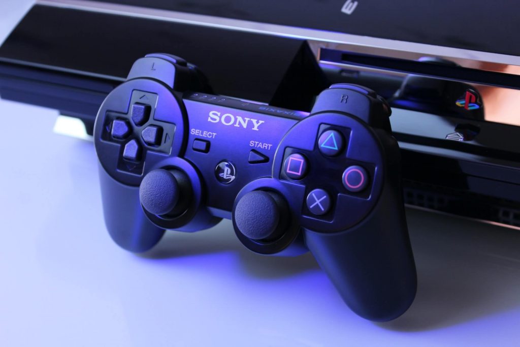 A PlayStation 3 gaming console, featuring a sleek design and the iconic PlayStation logo.
